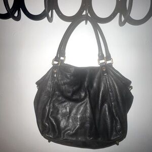 Liebeskind Berlin black leather handbag with gold hardware.